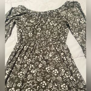 Green dress with flowers on it. Never worn. Girls size large